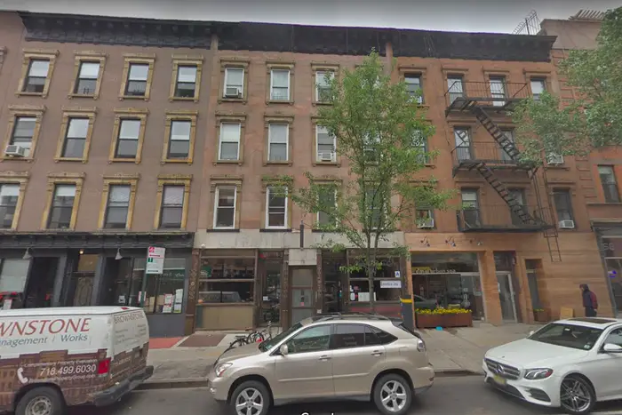 A fire at this 5th Avenue building killed one man and injured a woman.